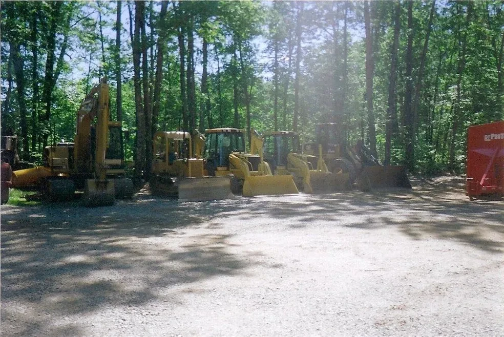 CAT excavator and dump truck at job site