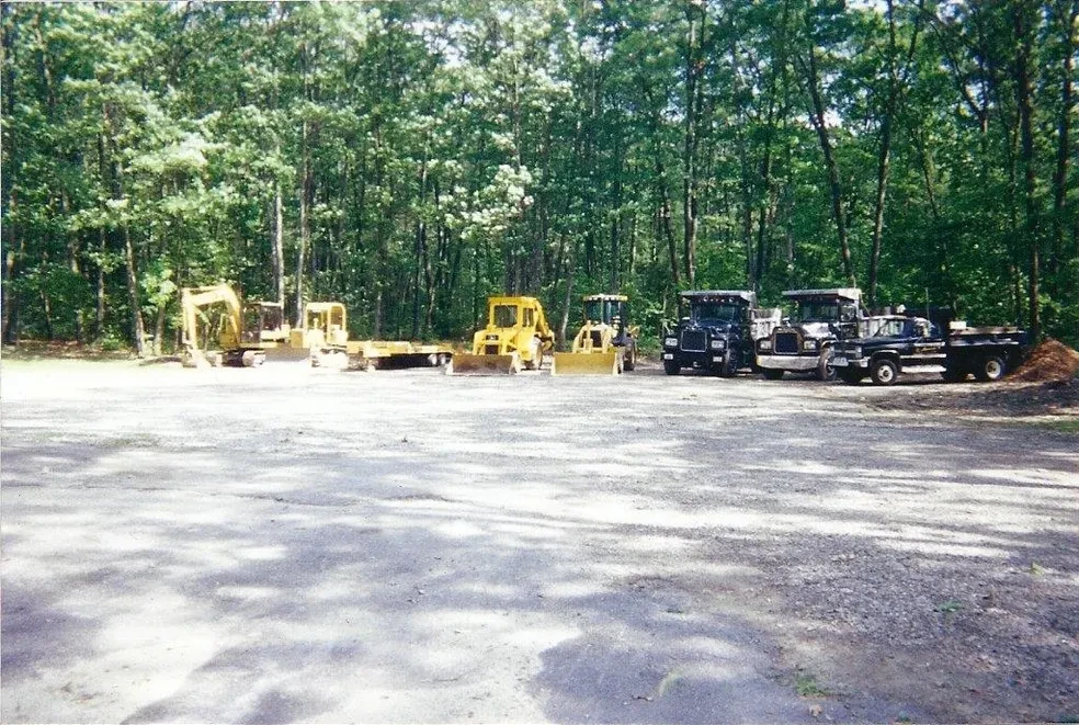 Mercurio equipment fleet parked in wooded yard